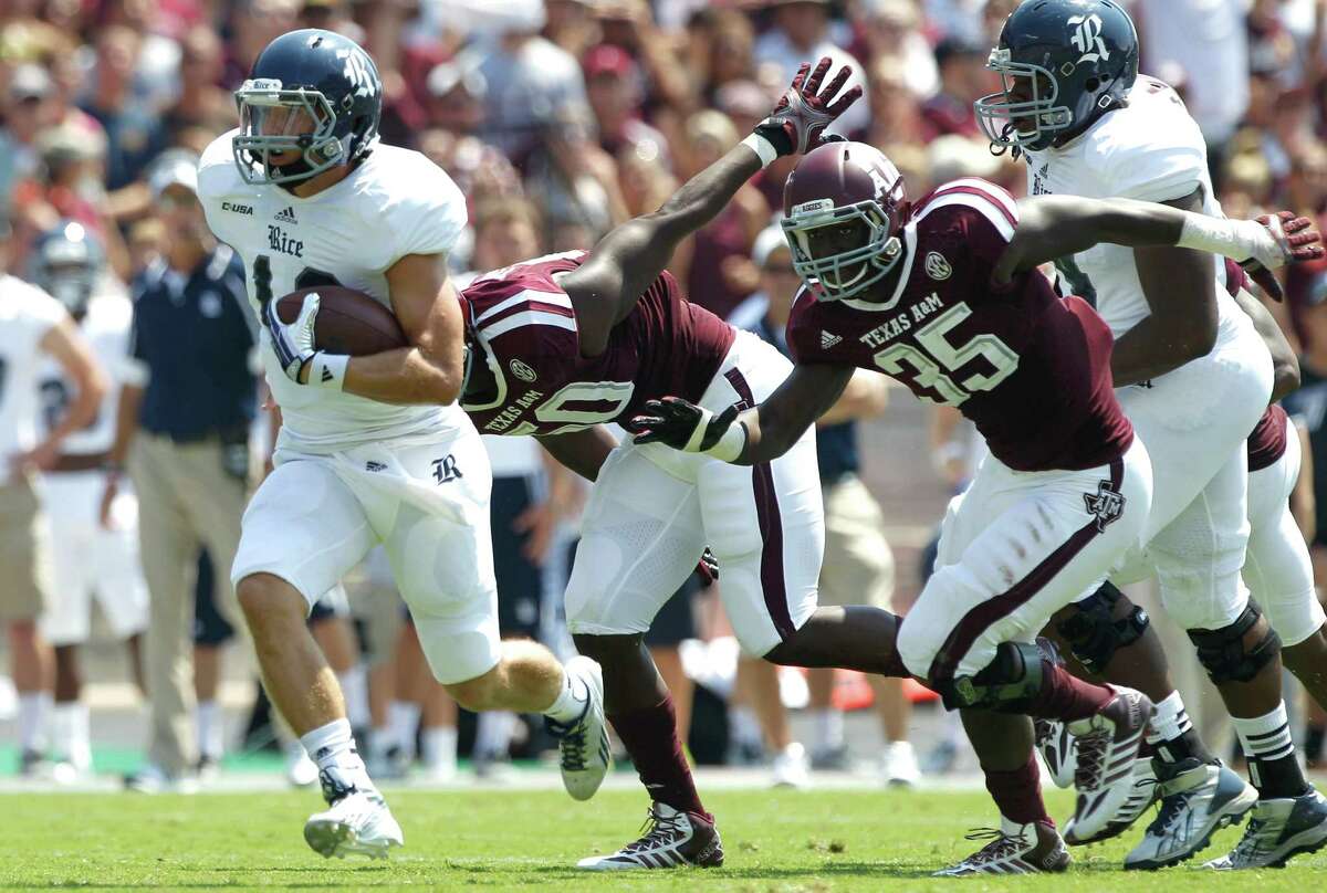 Rice quarterback Taylor McHargue, left, found lots of running room against A&M's makeshift defense.