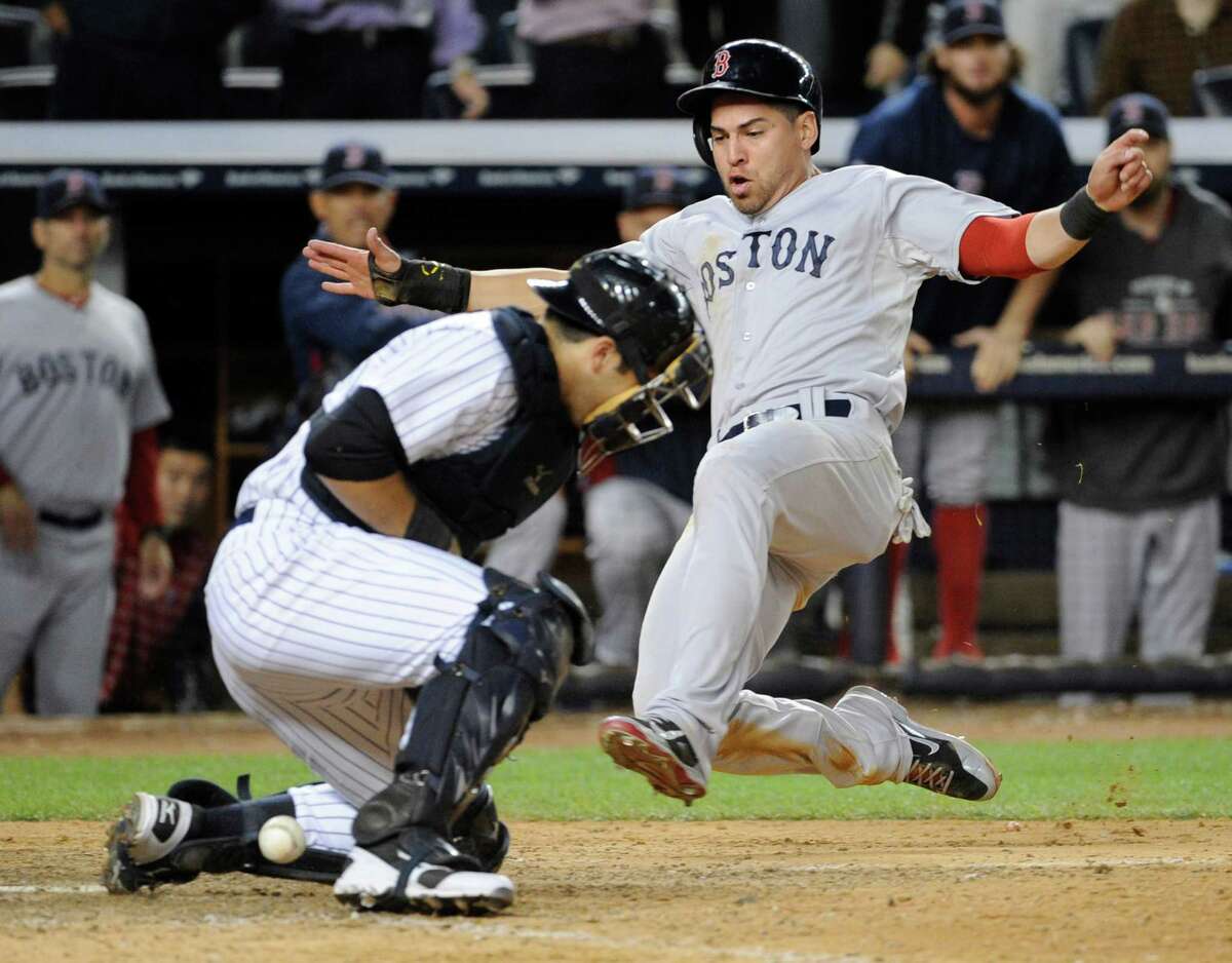Yankees catcher Austin Romine couldn't handle a throw home that beat Jacoby Ellsbury, who scored the winning run for the Red Sox in the 10th on Thursday.