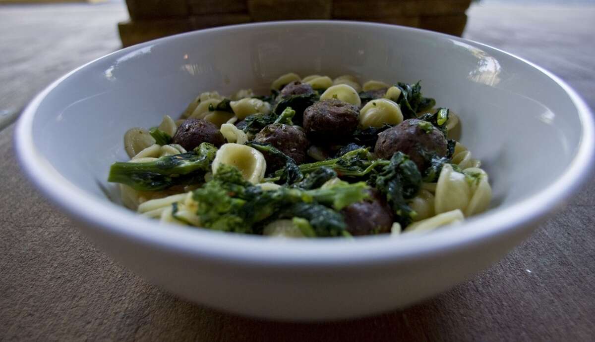 Orecchiette Giorgione "little ear" pasta with broccoli rabe, garlic & oil, spicy lamb meatballs at Giacomo's