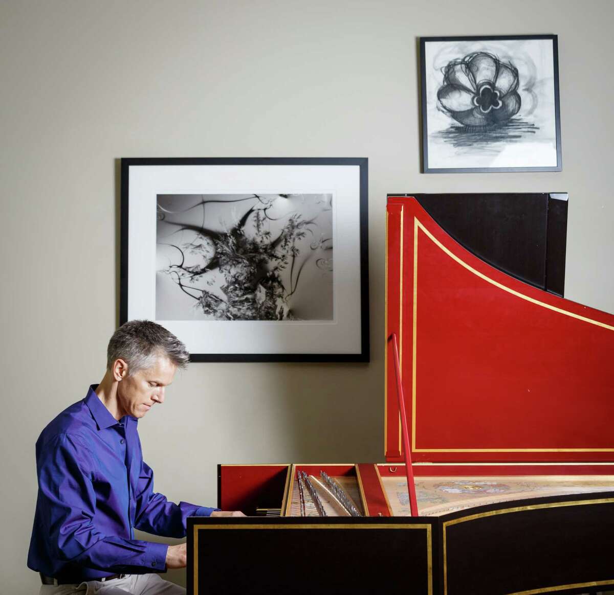 Matthew Dirst poses for a photo with his harpsichord at his home, Wednesday, Aug. 21, 2013, in Houston. Dirst is an organist, harpsichordist, University of Houston music professor and founder of the Ars Lyrica early music group. ( Michael Paulsen / Houston Chronicle )
