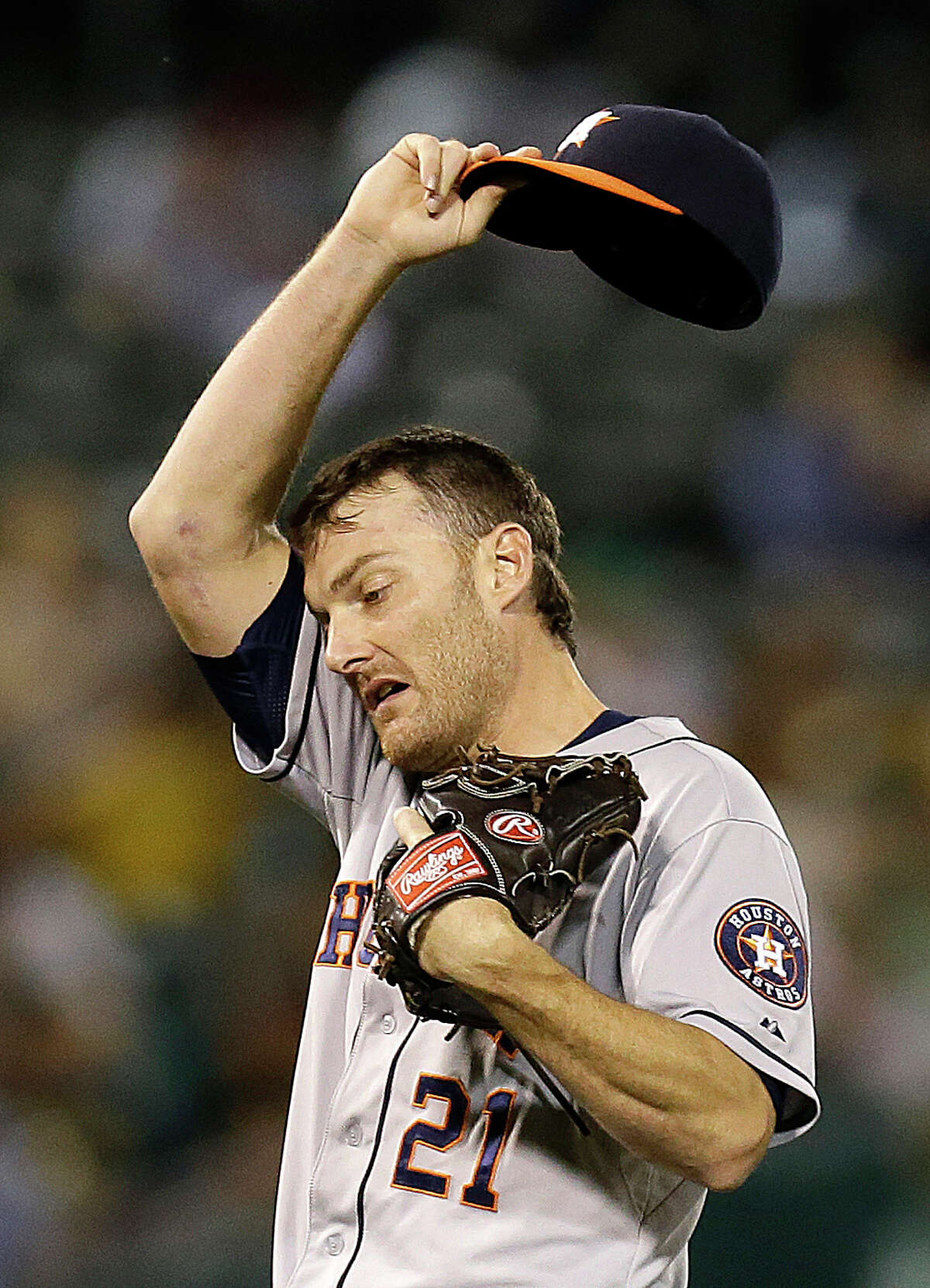 Astros reliever Philip Humber, who gave up two earned runs in 32⁄3 innings, wipes his brow in the seventh.