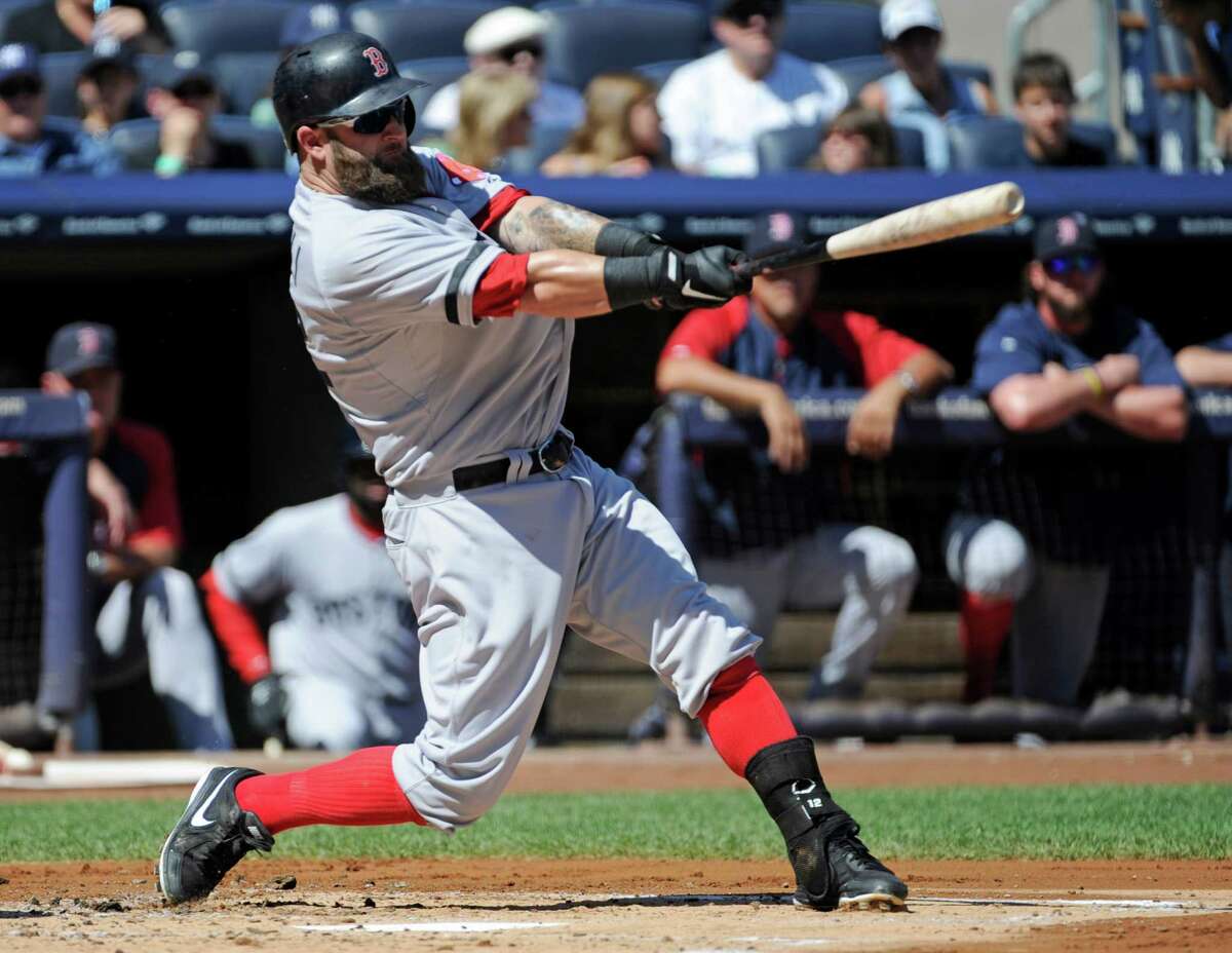 Boston Red Sox David Ortiz reacts while running the bases after he hits a  solo home run in the 4th inning against the New York Yankees at Yankee  Stadium in New York