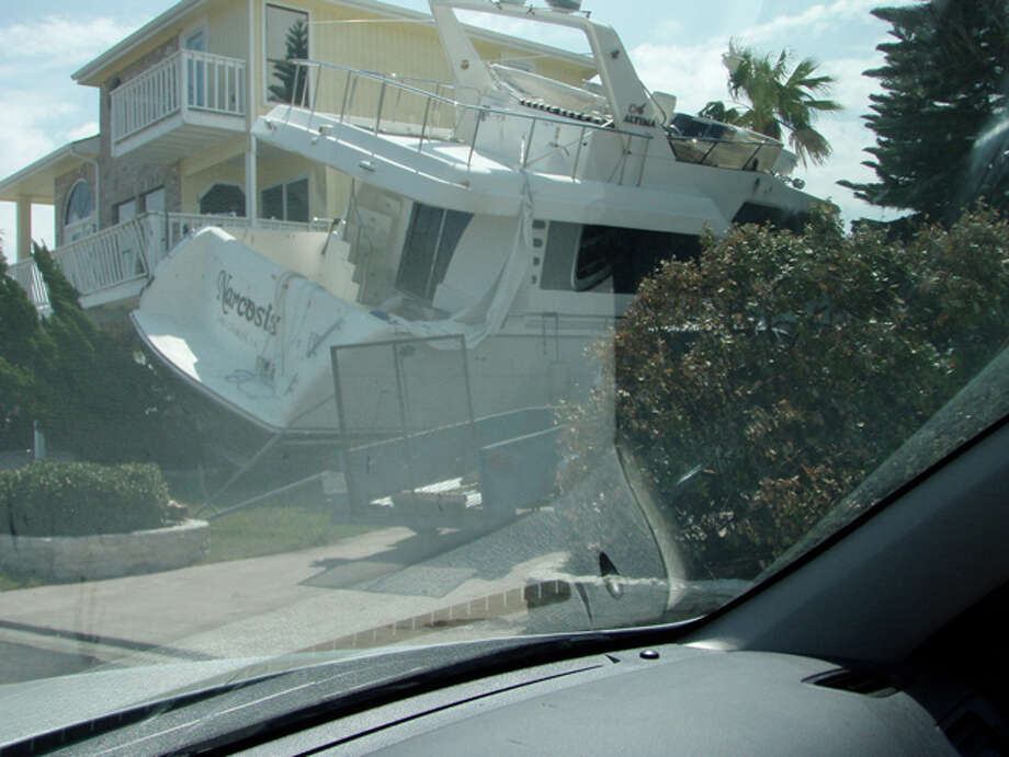 The North Shore photos show large boats that washed onto the island and in yards, as well as some of the damage to homes. Photo: Karen Heck