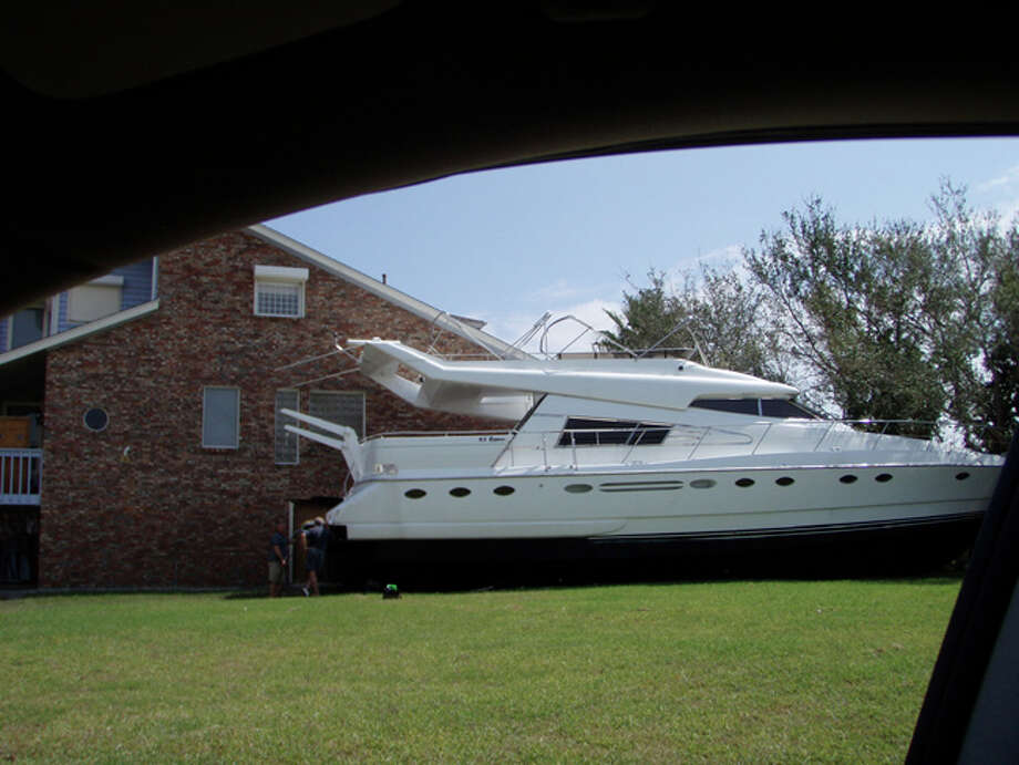 The North and West Shore photos show large boats that washed onto the island and in yards, as well as some of the damage to homes. Photo: Karen Heck