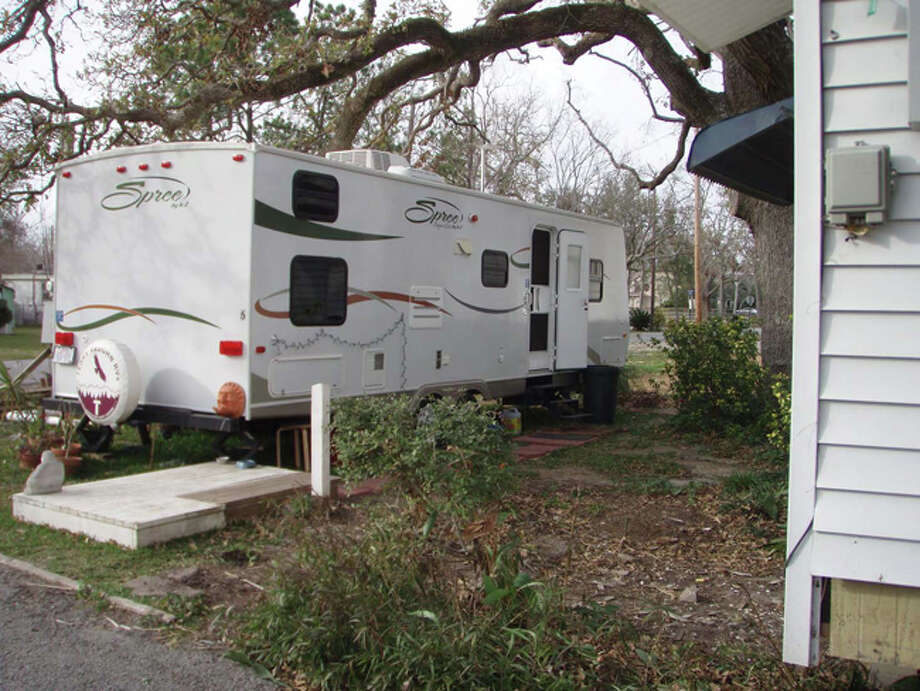 Temporary home was the travel trailer I rented and had placed in our front yard while repairs were made to our home. My teenage son and I lived there with our dogs and cat for five months. We spent the first three months at a friend’s house. Photo: Karen Heck