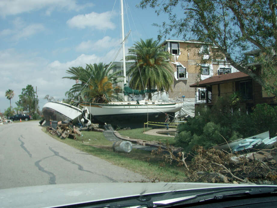 Large boats washed onto the island and in yards. Photo: Karen Heck
