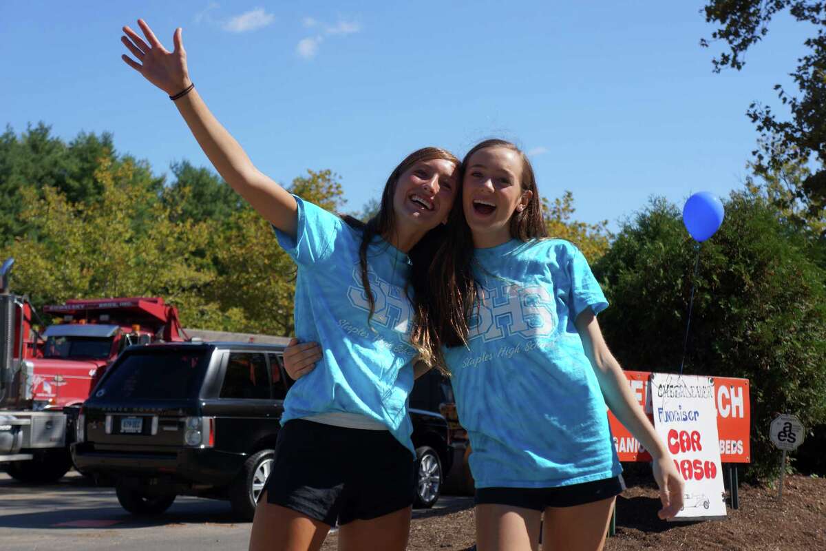 Tackling grime Staples cheerleaders make splash at car wash