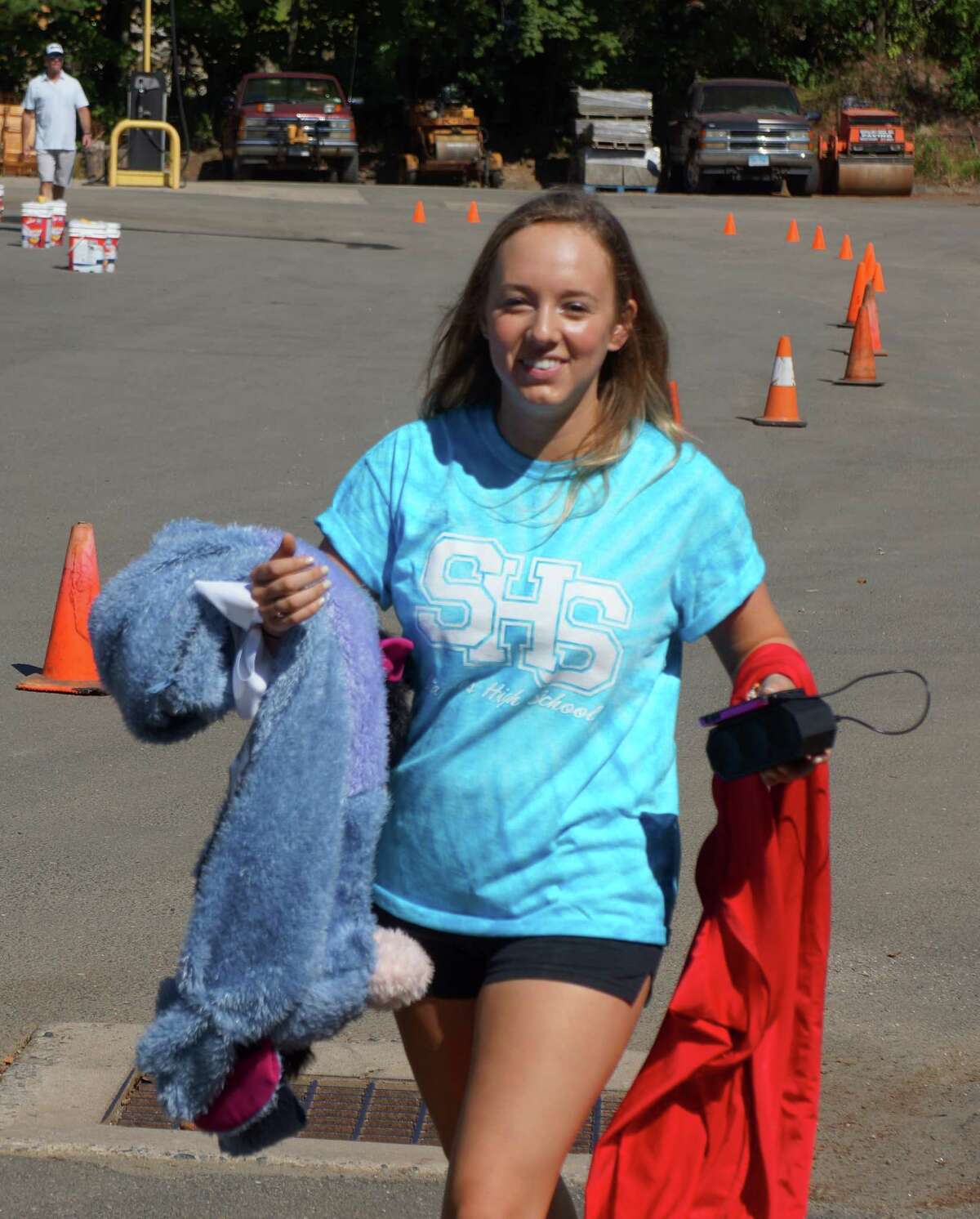 Tackling grime: Staples cheerleaders make splash at car wash