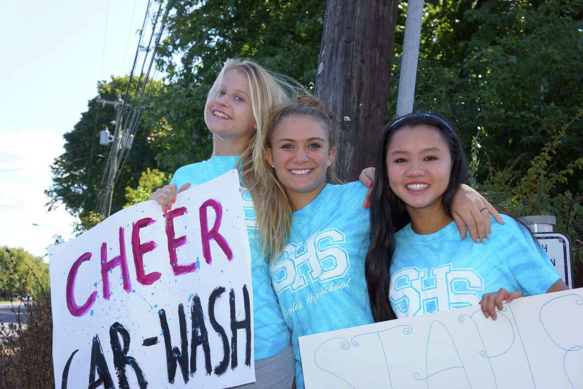 Tackling grime Staples cheerleaders make splash at car wash