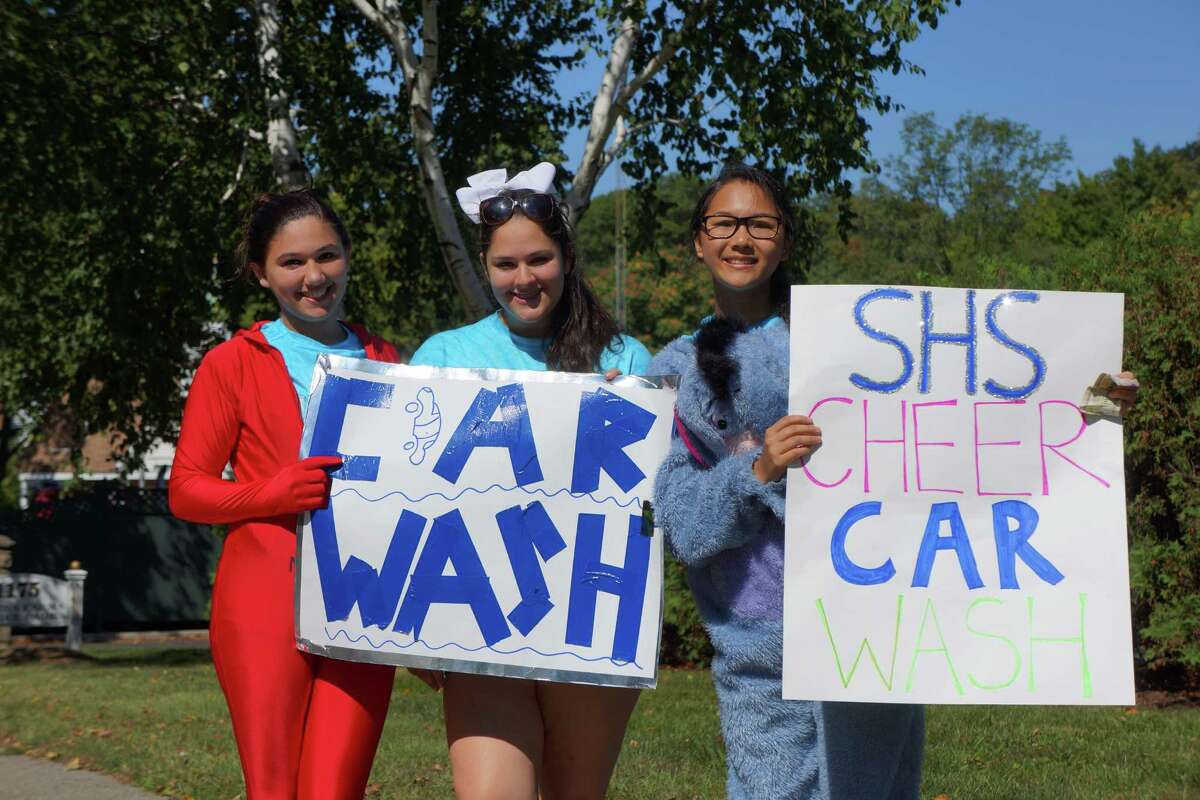 Tackling grime Staples cheerleaders make splash at car wash