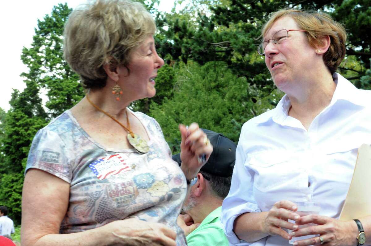 Stephanie Paulmeno, left, speaks with Beth Krumeich a candidate for the first selectman of the Town of Greenwich, at Greenwich Democratic Town Committee Campaign Kickoff and Picnic at Garden Education Center, Bible Street , Greenwich, Conn., Sunday, 8, 2013.
