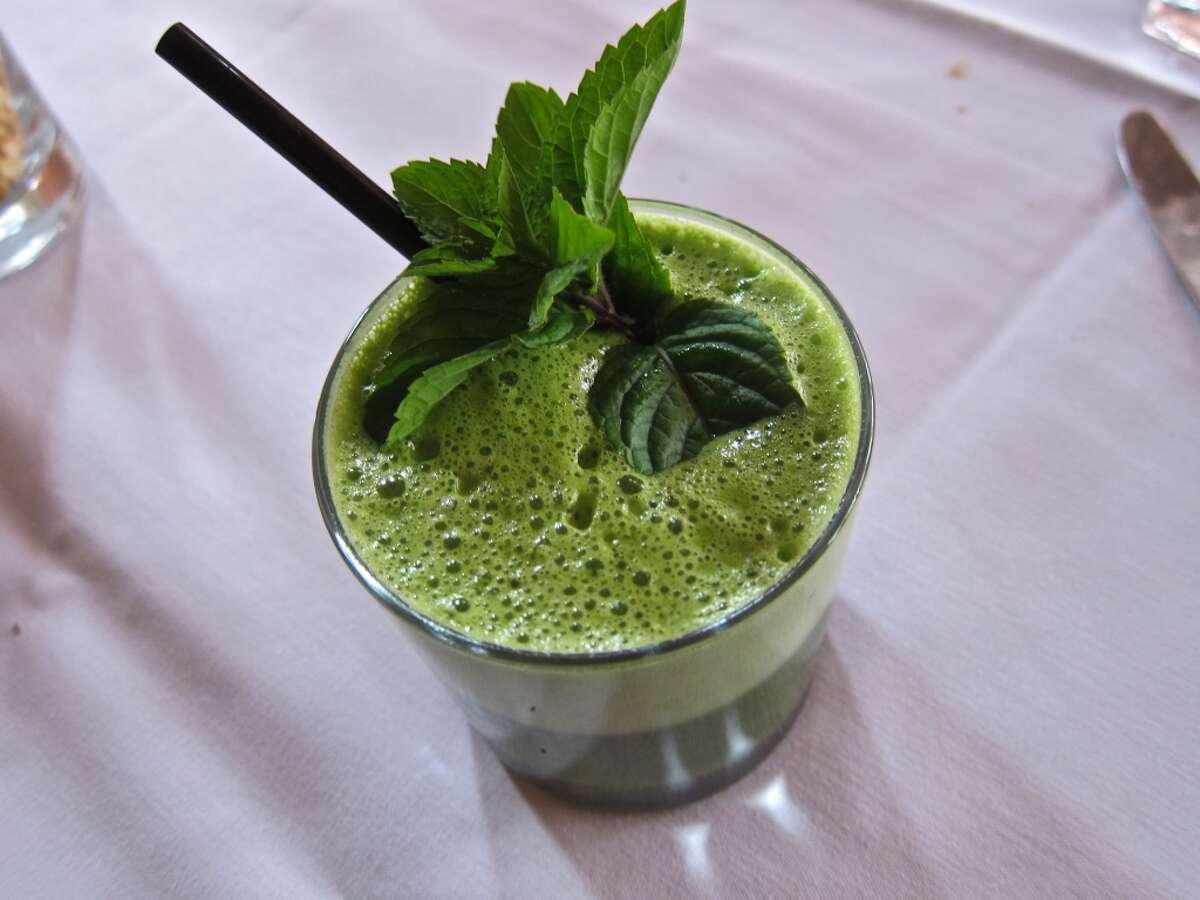 Kale juice with spinach, apple, mint, ginger and cilantro from the brunch menu at Indika.
