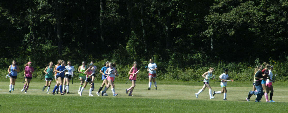The Spartans warm up for a pre-season practice for Shepaug Valley High School field hockey. September 2013