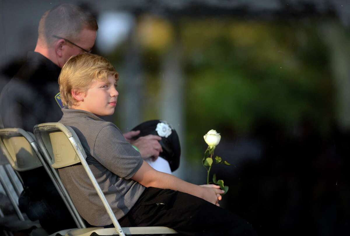 Bradley Vadas, 11, of Newtown, born two weeks after 9/11 and named for his uncle, 9/11 victim Bradley Vadas, looks out at the water as victims' names are read during the annual 9/11 Memorial Service Tuesday, September 10, 2013 at Connecticut's 9/11 Living Memorial at Sherwood Island State Park in Westport, Conn.