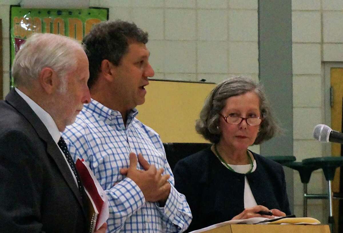 Discussing plans to open a medical marijuana dispensary at 222 Post Road during Tuesday's meeting of the Town Plan and Zoning Commission were, from left, pharmacist Robert Tender, applicant David Lipton and lawyer Diane Whitney. FAIRFIELD CITIZEN, CT 9/10/13