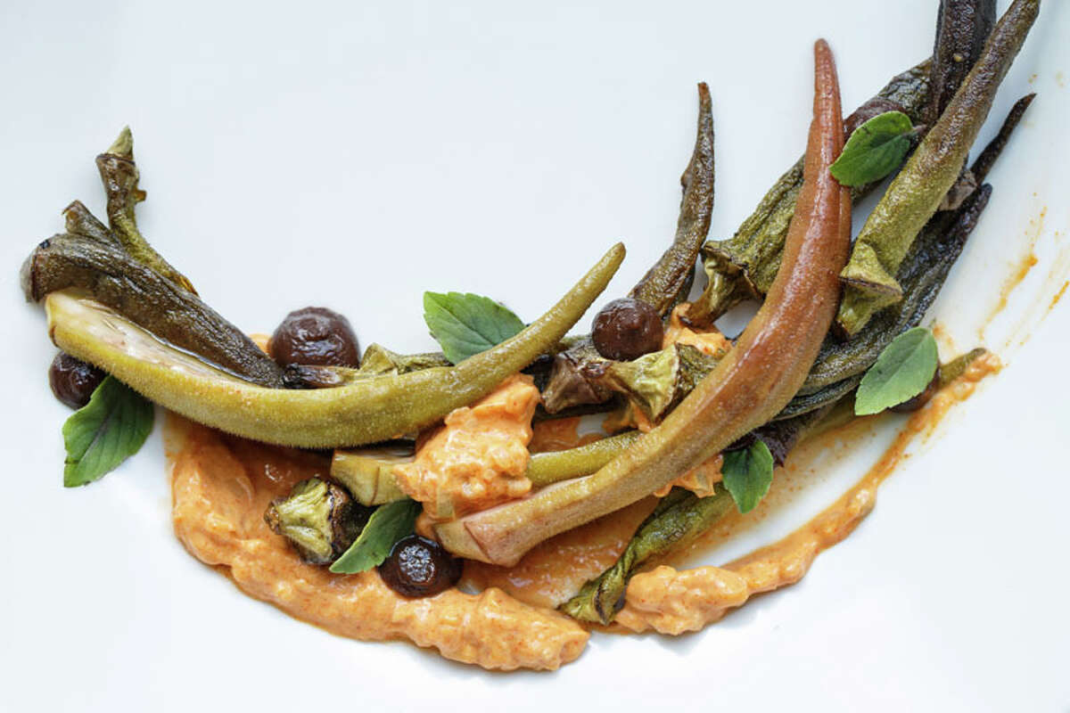 Once a year, Alison Cook selects the top 100 restaurants in Houston. It's a daunting task. See who made the list in 2013 and look for this year's list  September 25.  1. Oxheart Cuisine: New American Dish: slowly roasted and pickled okra, with smoked black garlic, creme fraiche, and 'african blue' basil Entree price range: $$$ Where: 1302 Nance Phone: 832-830-8592 Website: oxhearthouston.com Read Alison Cook's review of Oxheart