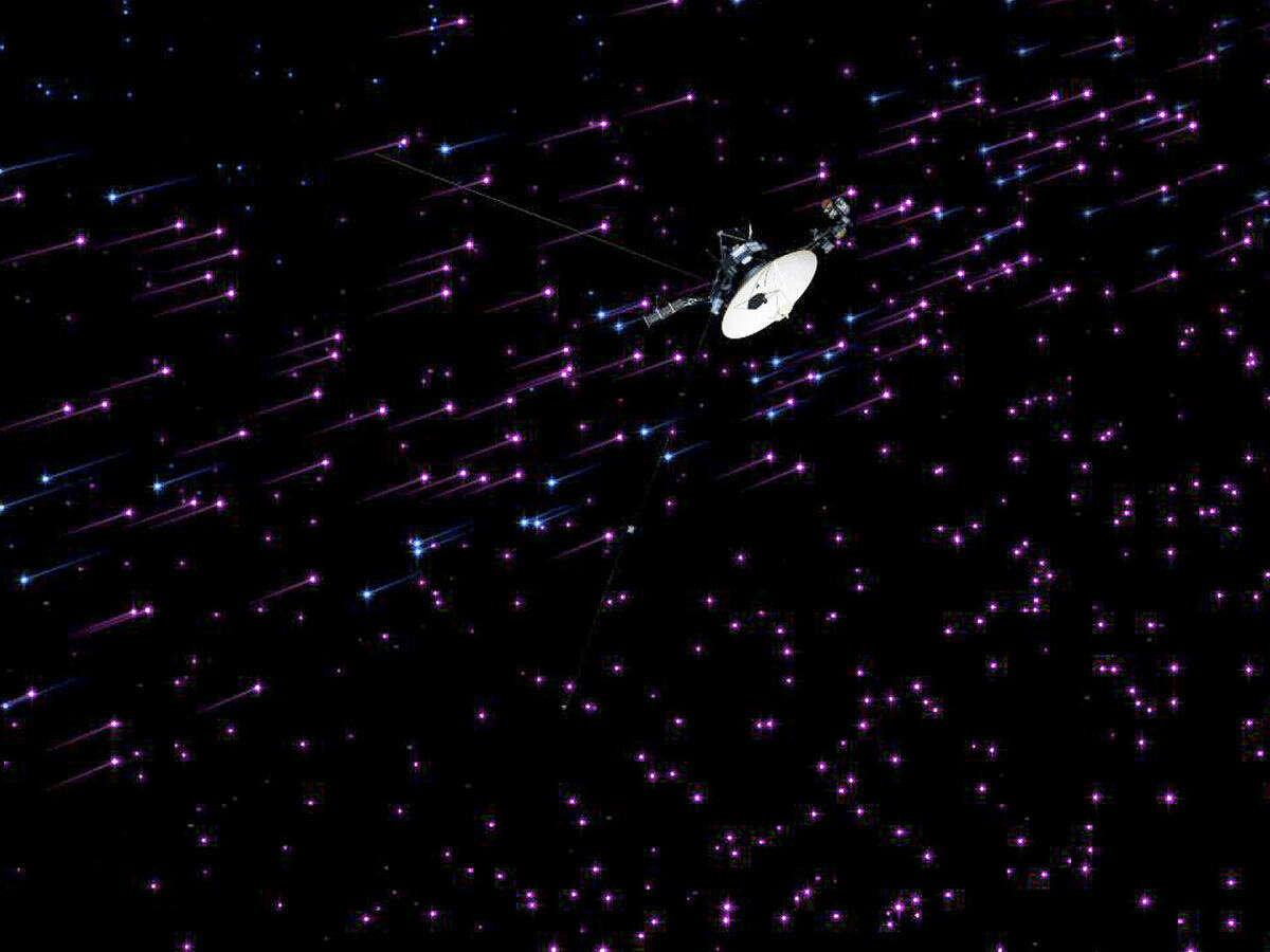 An undated illustration shows NASA's Voyager 1 spacecraft passing through an area near the edge of the solar system known as the magnetic highway.