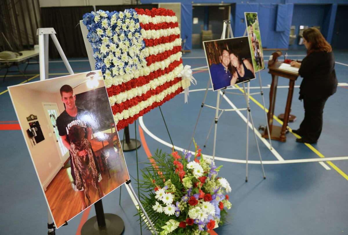 Mourners honor Stamford officer's slain son