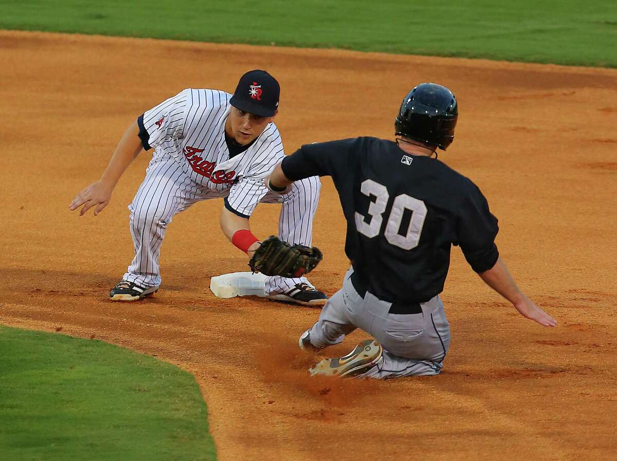 Arkansas' Taylor Lindsey waits to make the tag as the Missions' Cory Spangenberg tries to steal second in the first inning. The Missions didn't take full advantage of the six hits and seven walks Arkansas allowed.