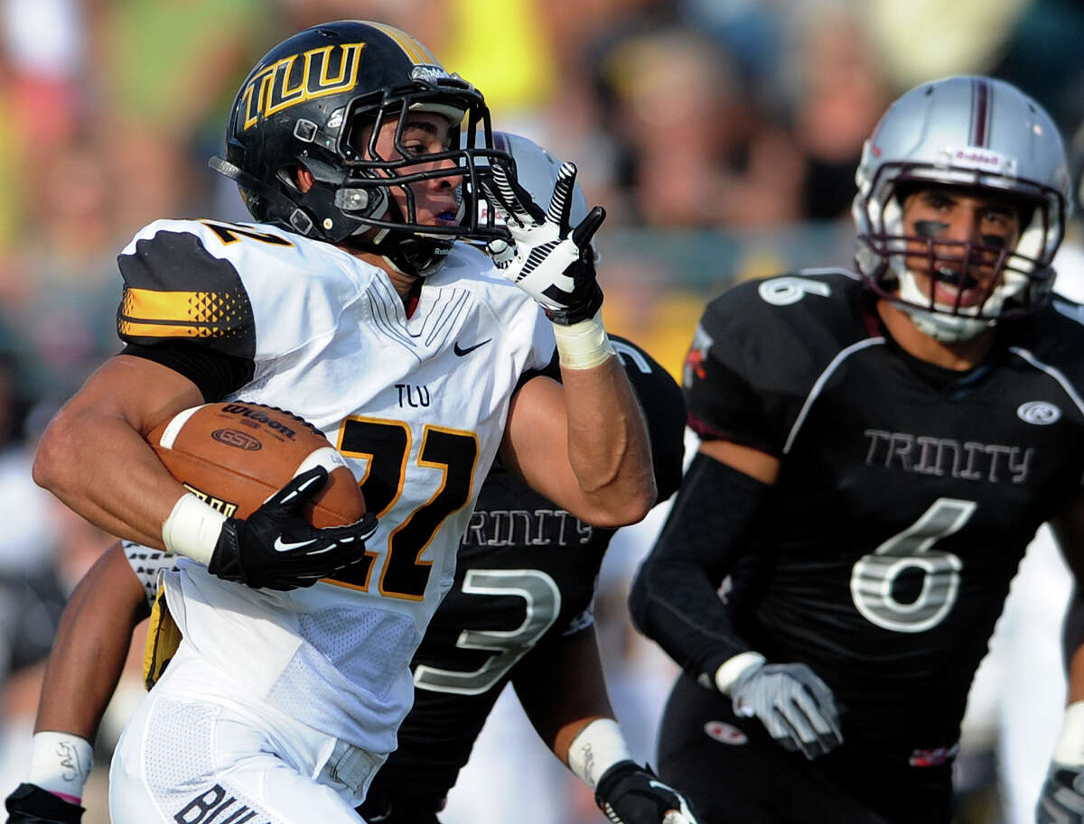 A.J. Saucedo of Texas Lutheran runs for a score against Trinity during college football action at Trinity University on Saturday, Sept. 14, 2013.