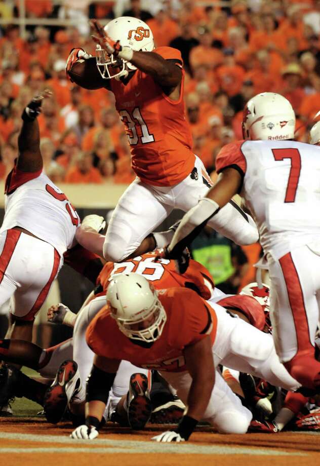 Oklahoma State rolls Lamar, 593 Beaumont Enterprise