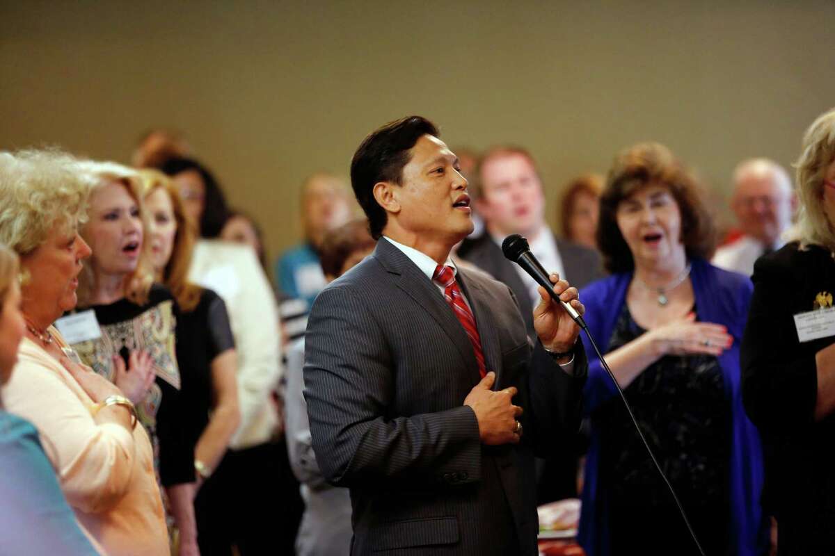 Danny Nguyen leads the Republican women in the singing of the national anthemduring a debate between the four candidates for lieutenant governor, Monday, September 16, 2013 at the Republican's women's forum at the Doubletree hotel in Houston, Texas. (PHOTO BY TODD SPOTH)