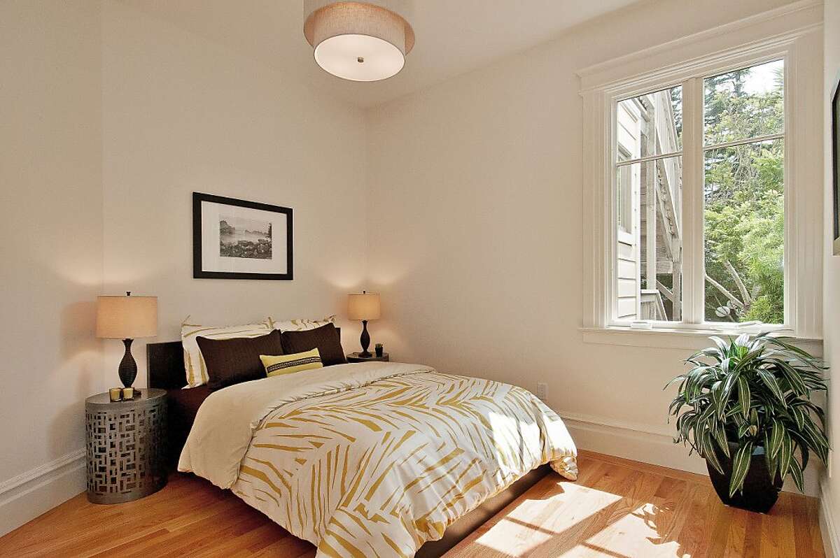 Eureka Valley condo has two levels, period details