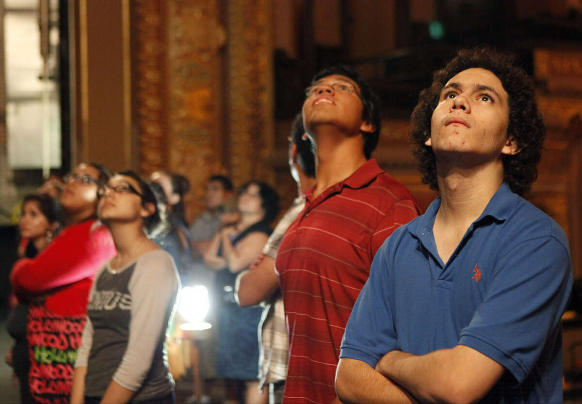 Ike Amador (right) and other students take a tour of the Empire Theatre as part of the Behind the Scenes program.