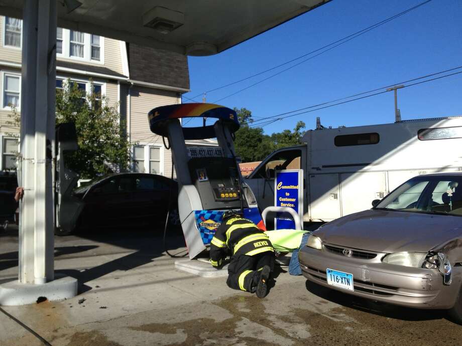 Car strikes gas pump; spill contained Connecticut Post