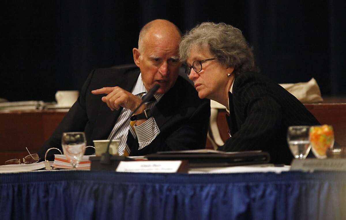 Gov. Jerry Brown talks with Aimee Dorr , Provost and Executive Vice President for academic affairs, as they sits among the UC Regents for the launch a of social media campaign to raise scholarship funds, Wednesday September 18, 2013, in San Francisco, Calif. Promise for Education is a six week crowd funding campaign that engages students, faculty, alumni, celebrities, businesses politicians and supporters in raising money for UC student scholarships.