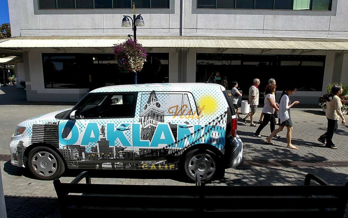 A new mobile outreach vehicle, designed by the local business Oaklandish, is parked in front of the Visit Oakland Center, on Tuesday Sept. 17, 2013, at Jack London Square in Oakland, Calif. The center has plans of driving the vehicle to Santa Monica this weekend to market the City of Oakland. The City of Oakland is renewing it's push to convince tourists that the city is safe by opening a visitors center designed to encourage people to visit.