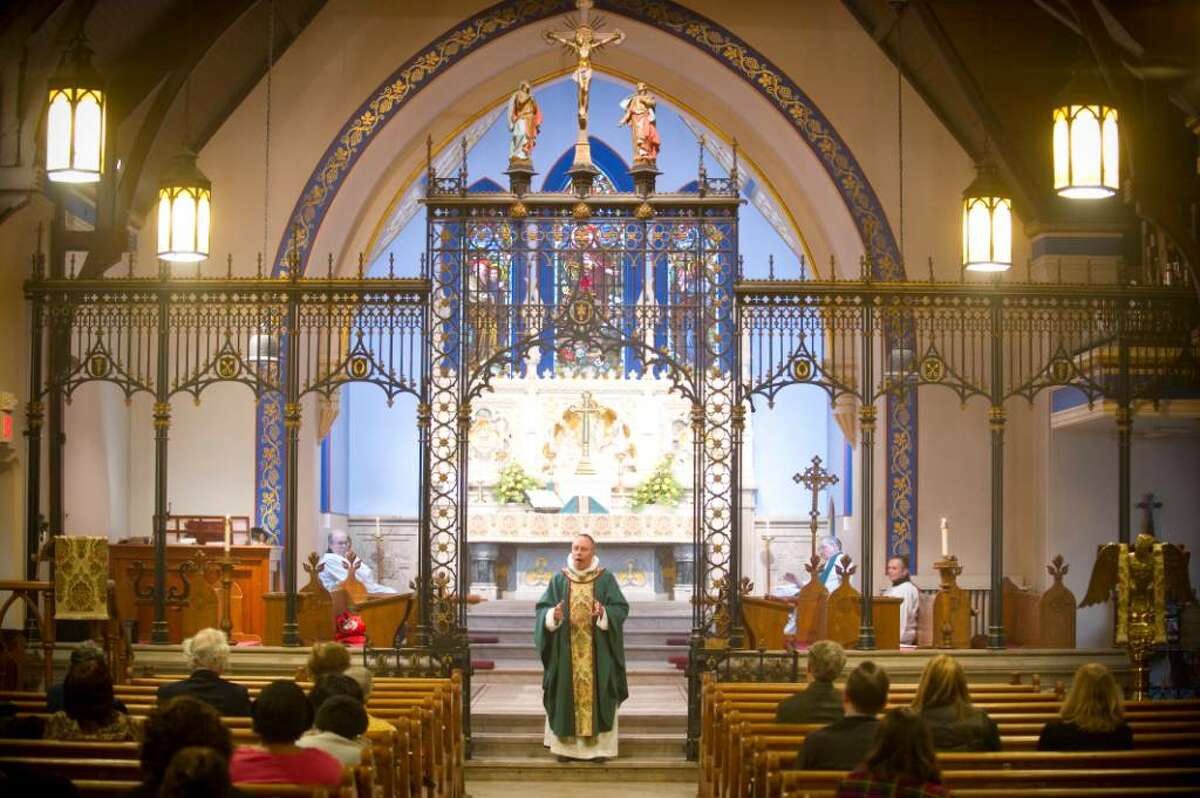 Rev. Fr. Richard C. Alton speaks during the service at St. Andrew's Episcopal Church in Stamford, Conn. on Sunday, Jan. 24, 2010. The church recently won the right in court to demolish their 136-year-old rectory, which was opposed by local preservationists.