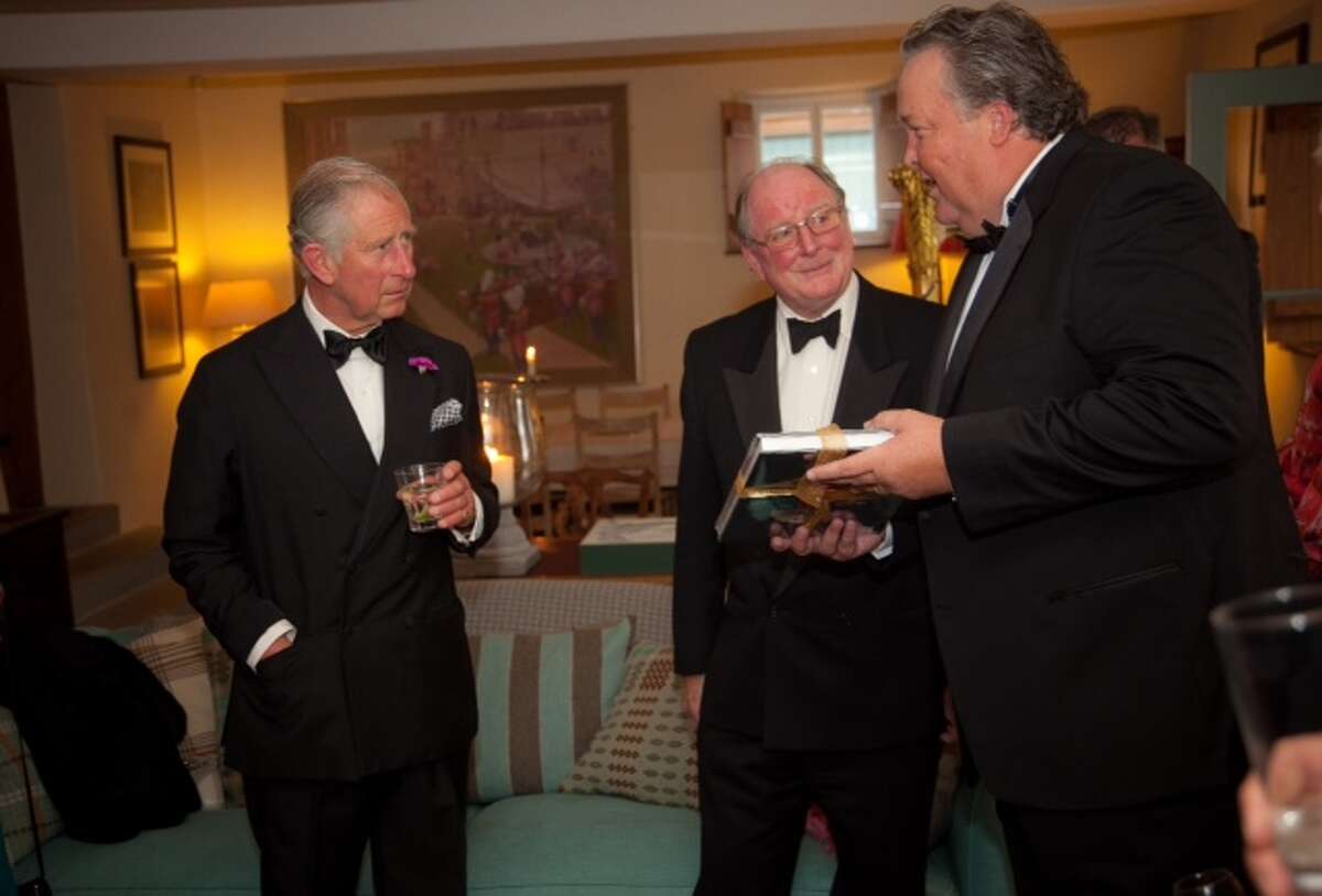 In this courtesy photo provided by the Hereford Cathedral Perpetual Trust, from left, England's Prince Charles, Christopher James, Chairman of Hereford Perpetual Trust, and Joel A. Bartsch, President of the Houston Museum of Natural Science gather for a black-tie dinner at Prince Charles' country estate in Wales, Llwynywermod, where a partnership was discussed to bring one of the four 1217 Magna Cartas to the Houston Museum of Natural Science for viewing. The British archive that holds the document says the trip might be the first time it has left Hereford, England, since it was issued. (AP Photo/Huw Evans Picture Agency, Gareth Everett)