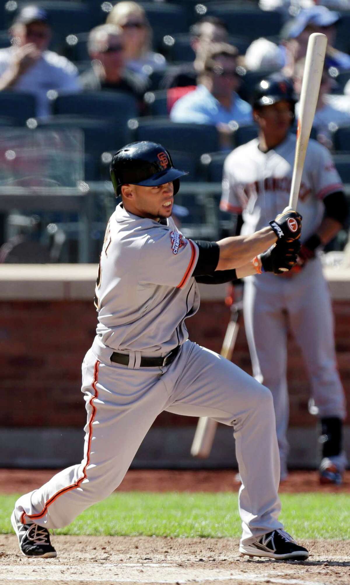 San Francisco Giants' Juan Perez hits an RBI single during the fourth inning of a baseball game against the New York Mets Thursday, Sept. 19, 2013, in New York. (AP Photo/Frank Franklin II) ORG XMIT: NYM106