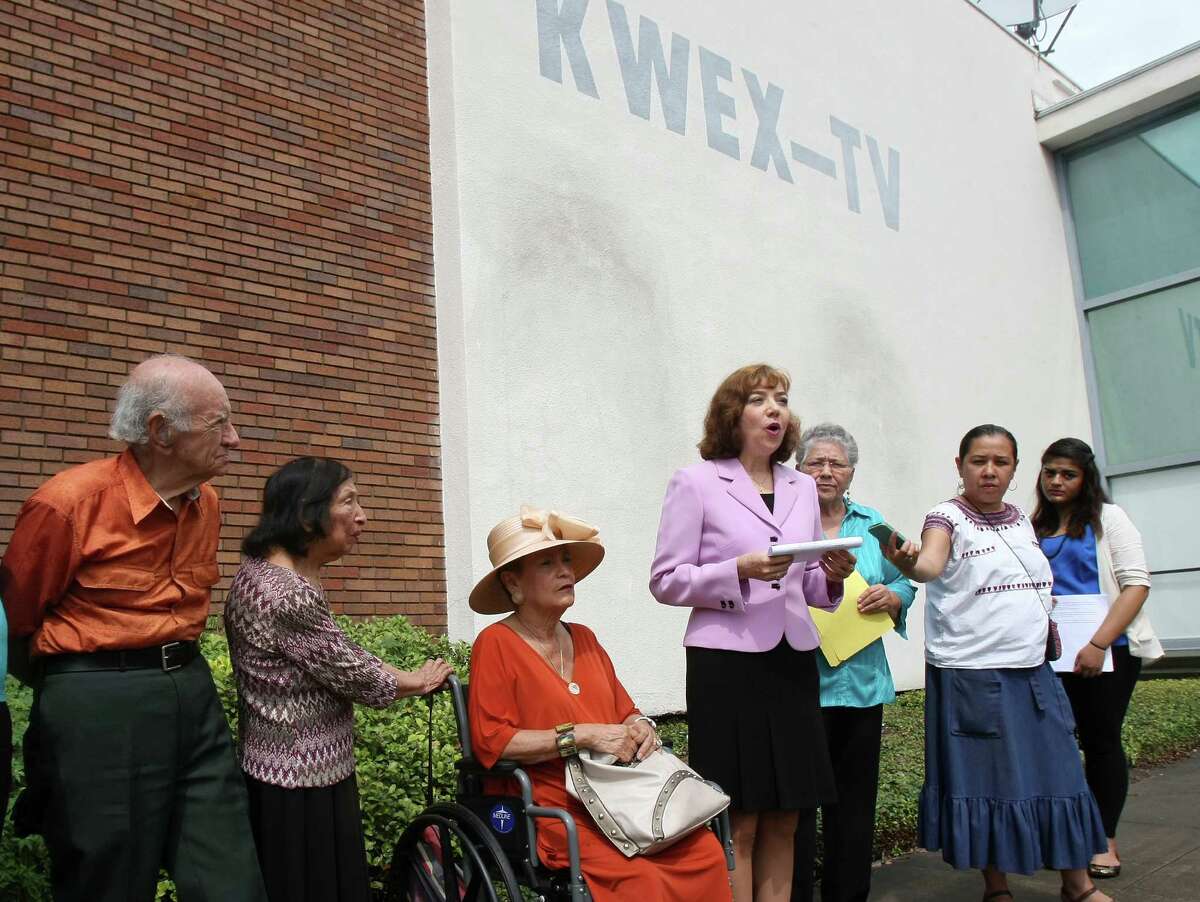 Members of the Westside Preservation Alliance and Esperanza Peace and Justice Center protest the planned demolition of the 1950s Univision building, to allow for construction of a new apartment complex on the River Walk. The building housed the nation's first Spanish-language TV station and has ties to today's powerful Univision television network.