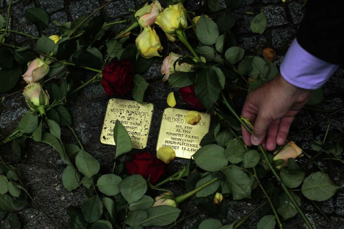 Flowers are placed near the so-called stumbling stones set by a German artist to remember Nazi victim Mildred Fish-Harnack and her husband, Arvid Harnack, in front of the last home they occupied in Berlin.