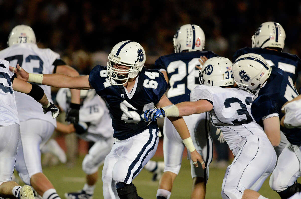 Staples football holds off Wilton