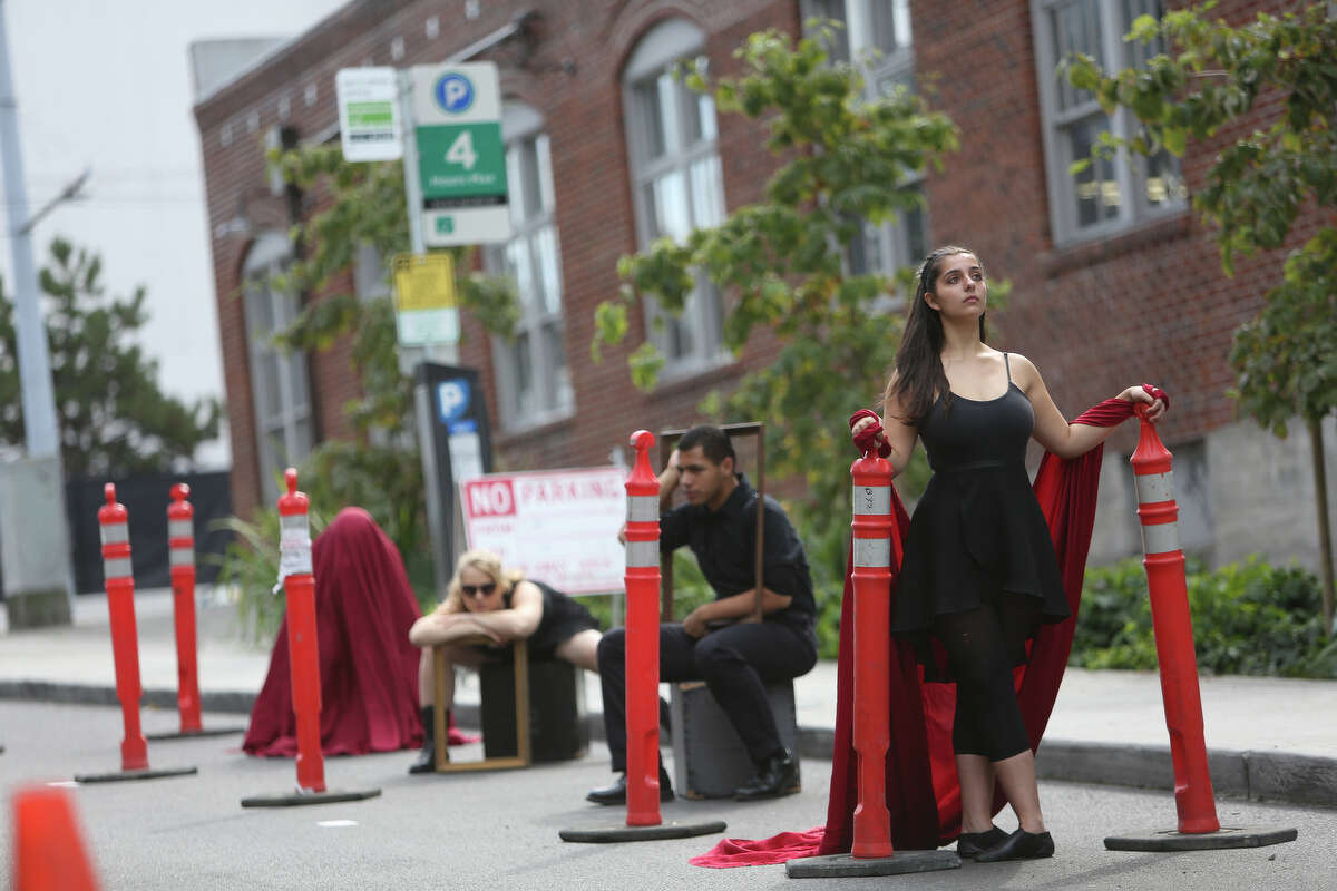 Cornish College of the Arts student Jebecca Janecek, right, poses with other students in one of the school's spaces used for performance art during PARK(ing) Day in Seattle.