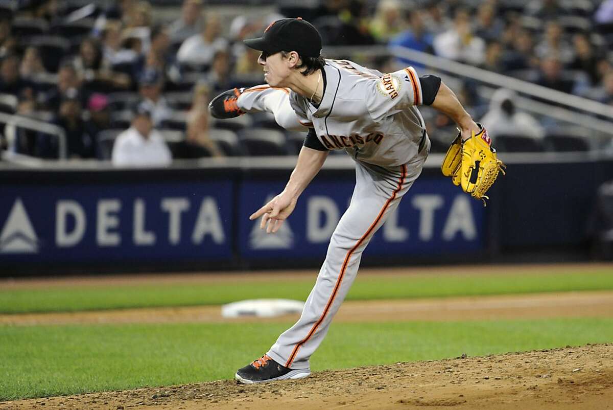 San Francisco Giants pitcher Tim Lincecum delivers the ball to the New York Yankees during the fourth inning of an inter-league baseball game Friday, Sept. 20, 2013, at Yankee Stadium in New York. (AP Photo/Bill Kostroun)