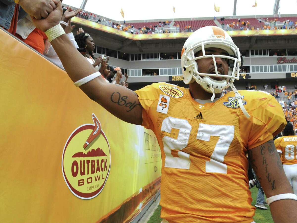 Texans running back Arian Foster, shown during his days at the University of Tennessee, says it was common for student-athletes to receive money on the side from outside sources.