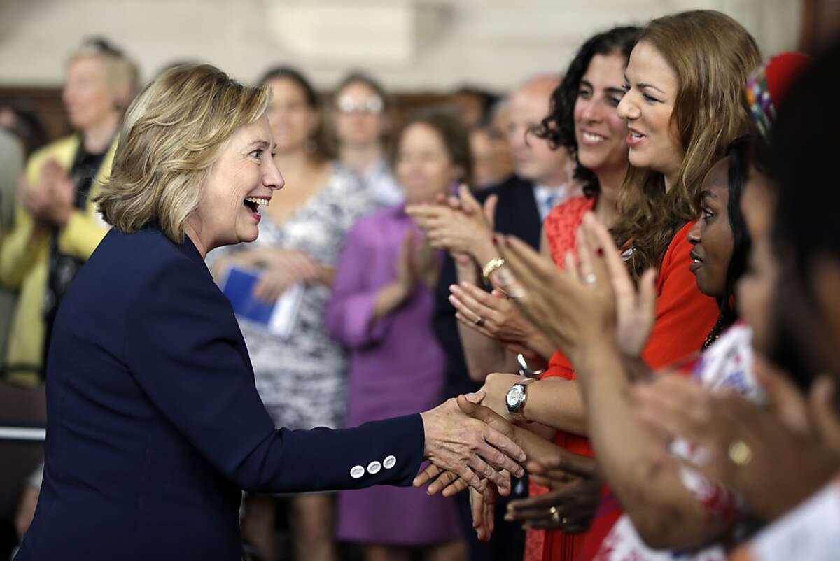 FILE - In this July 9, 2013 photo, Former Secretary of State Hillary Clinton meets with international delegates at the Women in Public Service Project leadership symposium, at Bryn Mawr College in Bryn Mawr, Pa. For all the talk that the former secretary of state intended to slow down after two decades in national political life, Clinton is keeping a busy schedule that amounts to a training camp for a second presidential campaign if she decides to run.