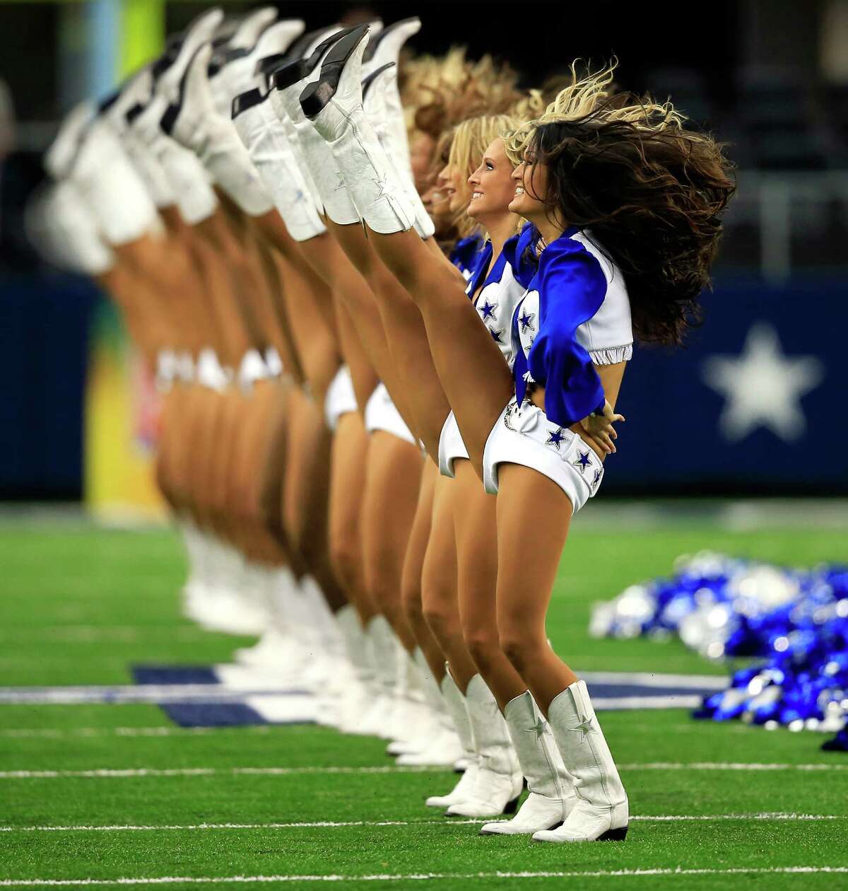 ARLINGTON, TX - SEPTEMBER 22: The Dallas Cowboys cheerleaders perform during the game against the St. Louis Rams at AT&T Stadium on September 22, 2013 in Arlington, Texas.