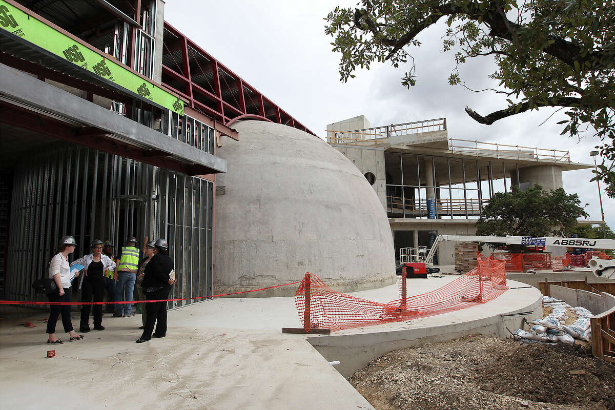 Officials tour the Scobee Planetarium and new home of the Challenger Learning Center at San Antonio College last week. The college will mark progress on the $12 million project with a ceremony Thursday.