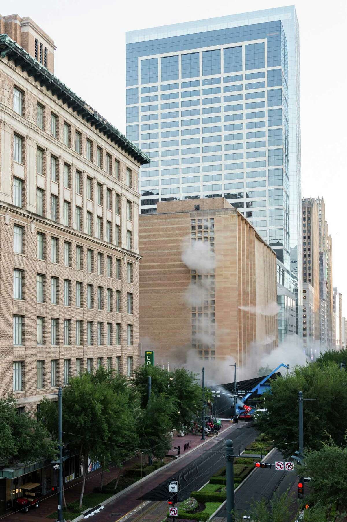 A series of explosive charges brings down the landmark former Macy's department store building in downtown Houston on Sunday, Sept. 22, 2013. Many Houstonians remember the store as Foley's, a homegrown retail chain that started downtown in 1900. As the store grew, it relocated and eventually moved into the building at 1110 Main in 1947. It was converted to Macy's in 2006 and operated at the site until closing in March. The 10-story, 791,000-square-foot building was reduced to rubble just after sunrise to make way for a still undisclosed new development. ( Smiley N. Pool / Houston Chronicle )