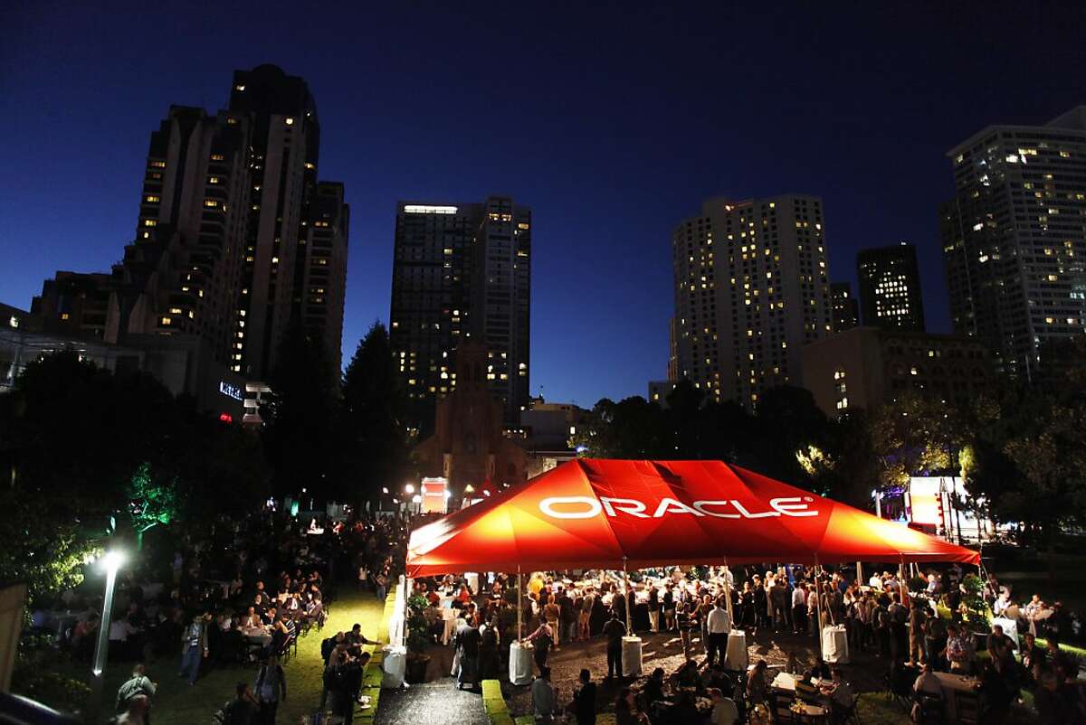 Party attendees gather under the Oracle Tent in Yerba Buena Garden on Sunday, Spet. 22, 2013 in San Francisco, Calif. An after party for Oracle OpenWorld 2013 attendees was held in Yerba Buena Garden.
