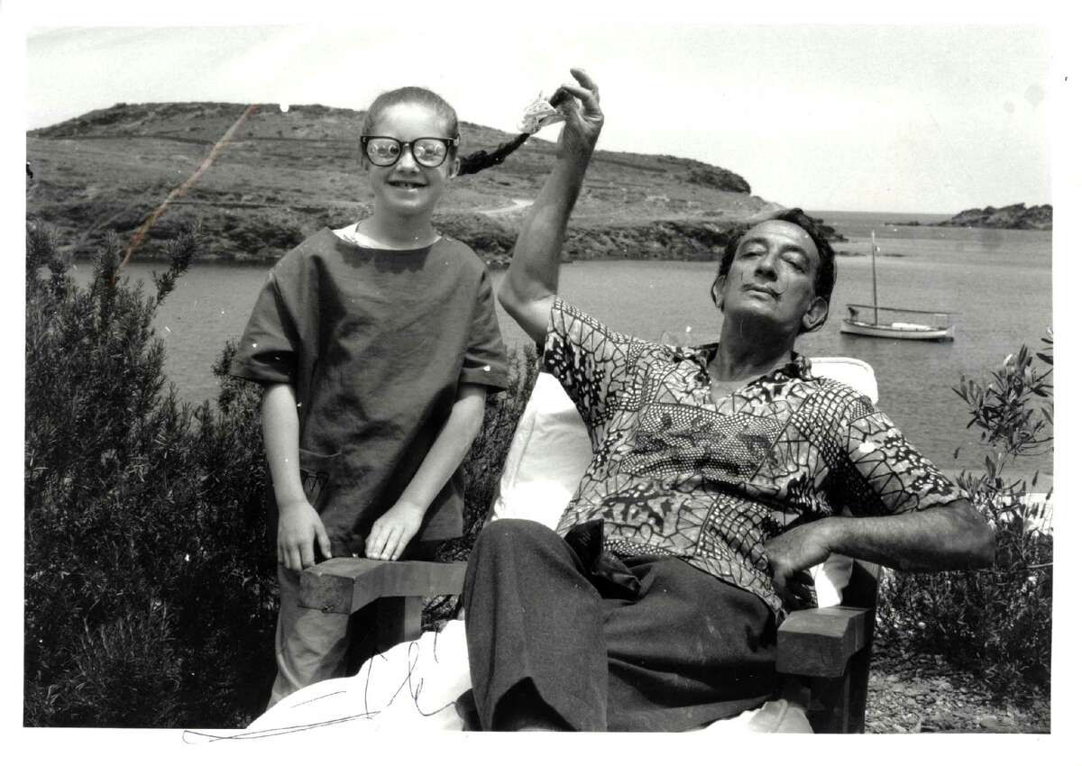 A young Christine Argillet clowns around with Salvador Dali, a close friend and associate of her father, the publisher Pierre Argillet.