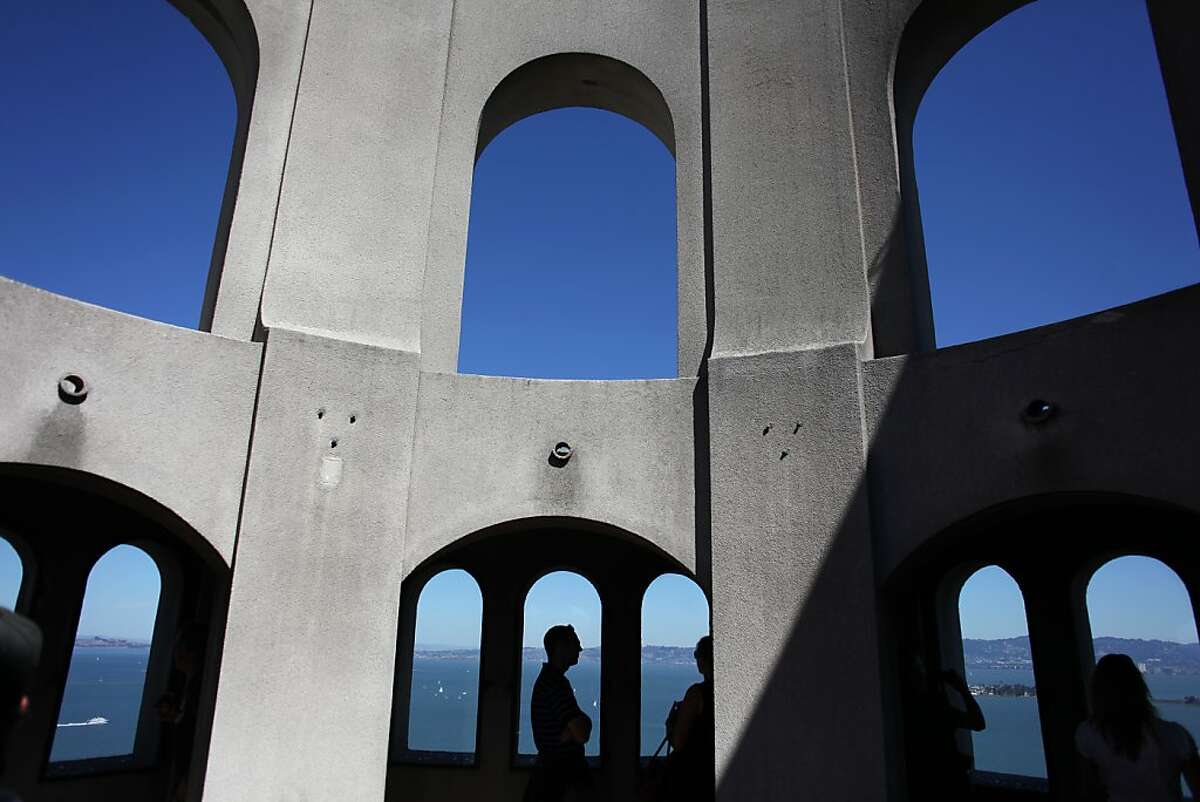 Visitors to Coit Tower are seen on the top floor on September 18, 2013 in the Telegraph Hill area of San Francisco, Calif.