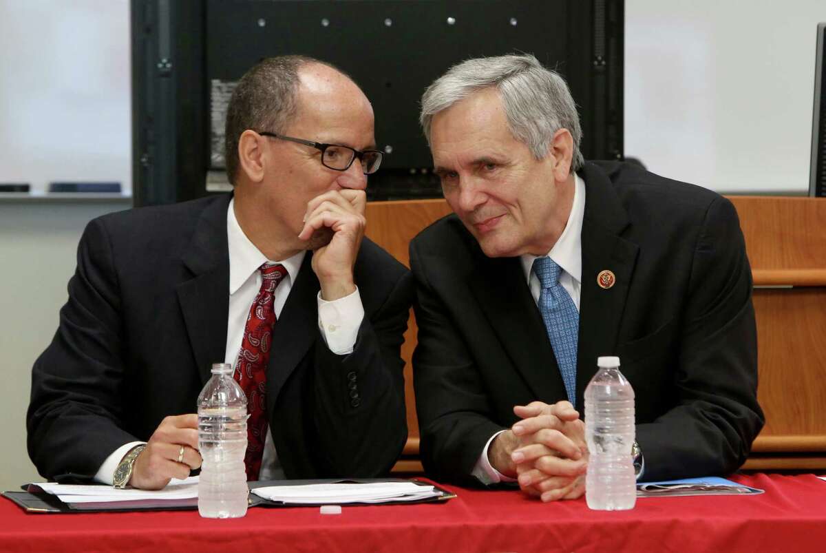 U.S. Secretary of Labor Thomas Perez talks with Congressman Lloyd Doggett before a forum at San Antonio College on the new health insurance laws a on Monday Sept. 23, 2013.