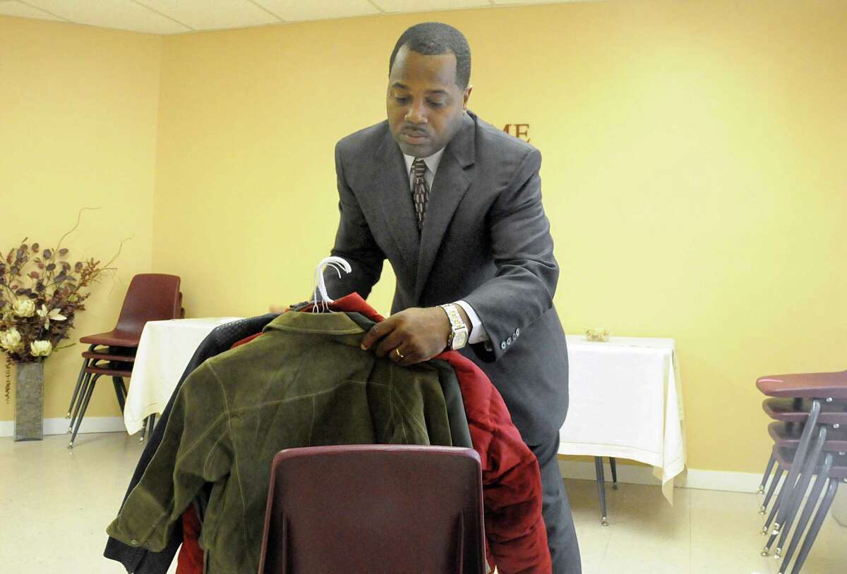 Brett James collects coats from parishioners at The Woodlands Impact Church, 5401 Shadowbend Place. The annual coat drive benefits the youth at Covenant House Texas.