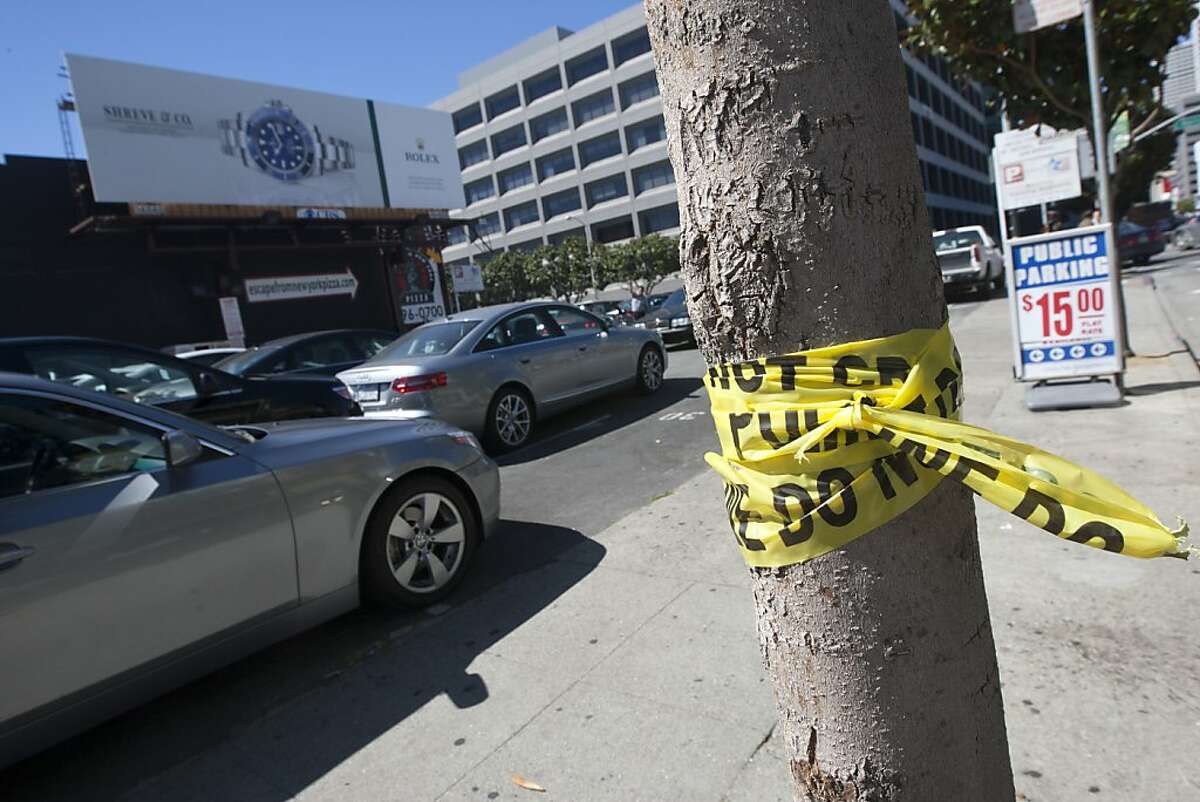 The remnants of police tape mark the area where Los Angeles Dodgers fan Jonathan Denver, 24, was stabbed late Wednesday night Sept. 25, 2013 near the corner of 3rd and Harrison Streets in San Francisco, Calif. Photographed on Sept. 26, 2013.